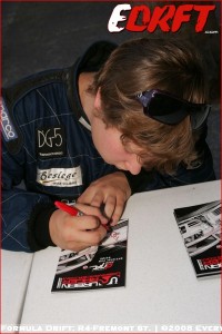 Pat signs an Autograph